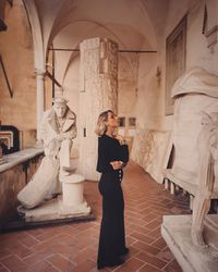 Full length of woman standing in building