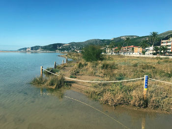 Scenic view of sea against clear blue sky