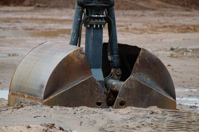 Close-up of machine part on field