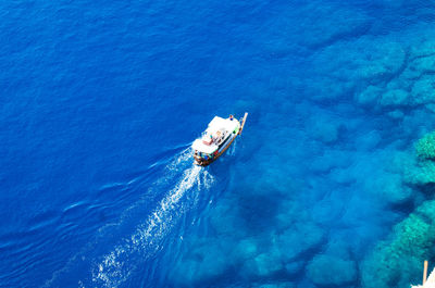 High angle view of sailboat sailing in sea