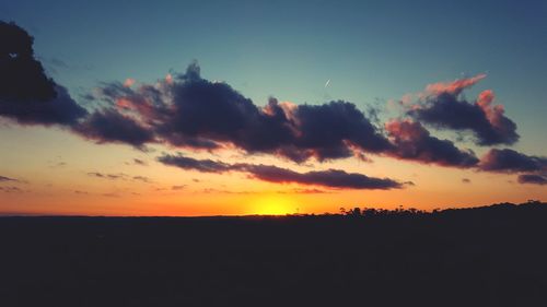 Scenic view of silhouette landscape against sky during sunset