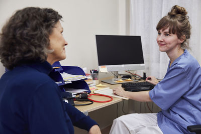 Patient and doctor in doctor's office