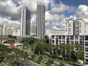 Modern buildings in city against sky