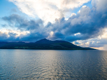 Scenic view of sea against cloudy sky