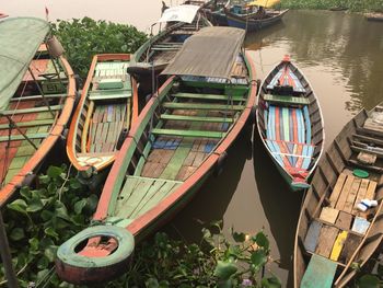 Panoramic view of boats moored in lake against buildings