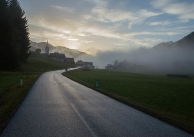 Road amidst landscape against sky