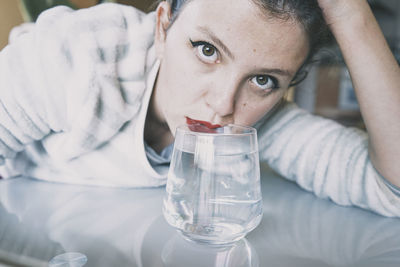 Close-up portrait of mid adult man drinking glass