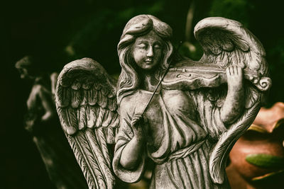 Close-up of angel statue in park