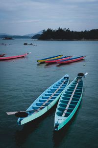 High angle view of boats moored in sea against sky