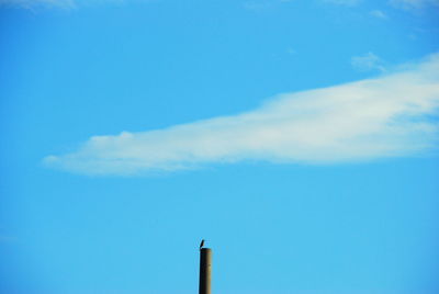 Low angle view of smoke stack against sky