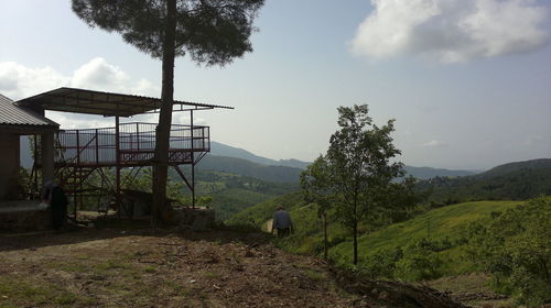 Rear view of man standing on mountain