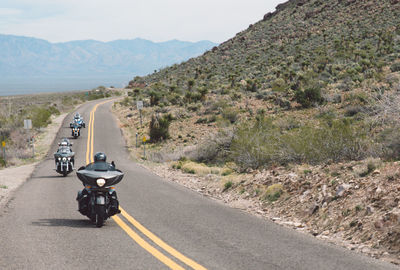 Car on road against mountain range