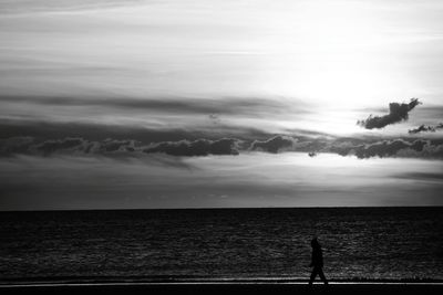 View of calm sea against cloudy sky