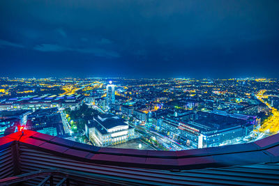 High angle view of illuminated buildings in city at night