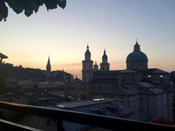 View of buildings against sky at sunset