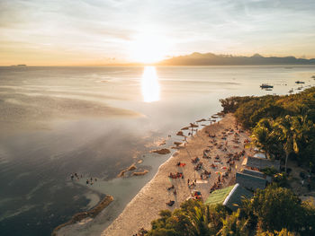 High angle view of sea against sky during sunset