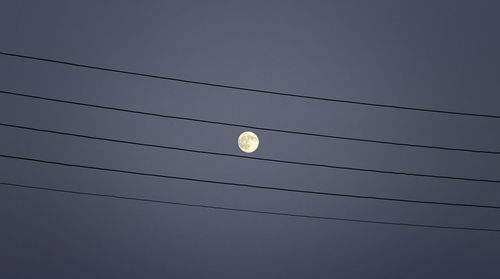 Low angle view of moon against clear sky