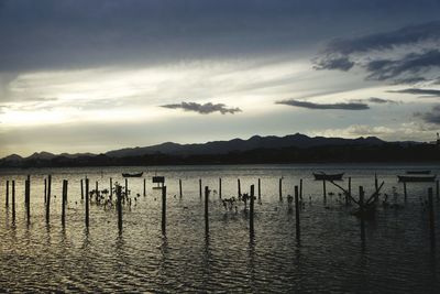 Scenic view of lake against sky during sunset