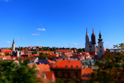 Townscape against clear blue sky