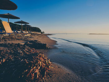 Scenic view of sea against clear sky during sunset