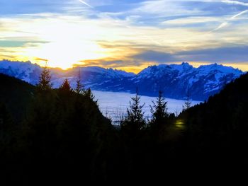 Scenic view of silhouette mountains against sky during sunset