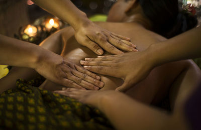 Cropped hands massaging customer