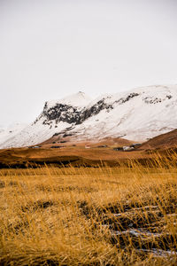 Scenic view of snowcapped mountain against sky