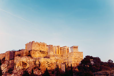 Low angle view of fort against blue sky