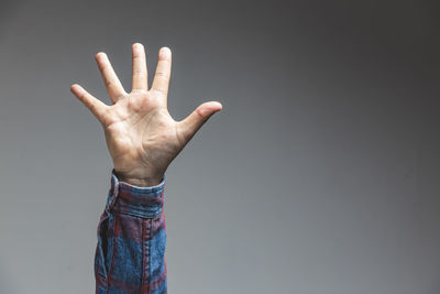 Midsection of person against sky over black background