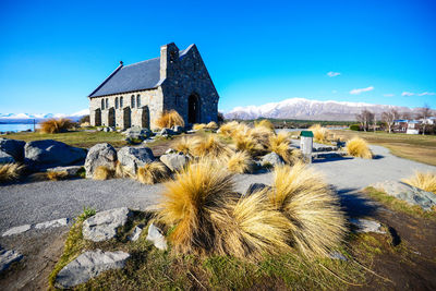 Buildings against clear blue sky