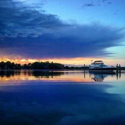 Scenic view of lake against cloudy sky