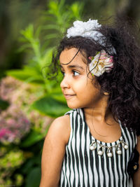 Portrait of a smiling girl looking away