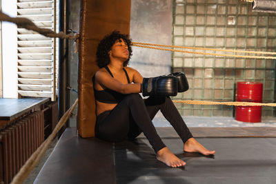 Young woman exercising in gym