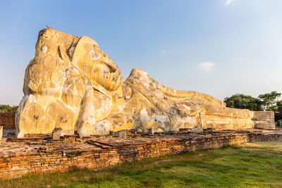 Rock formations on landscape against sky