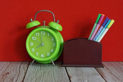 Close-up of clock on table