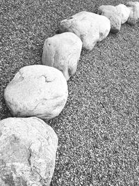 Close-up of rock on sand at beach