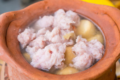 Close-up of meat in cooking pan