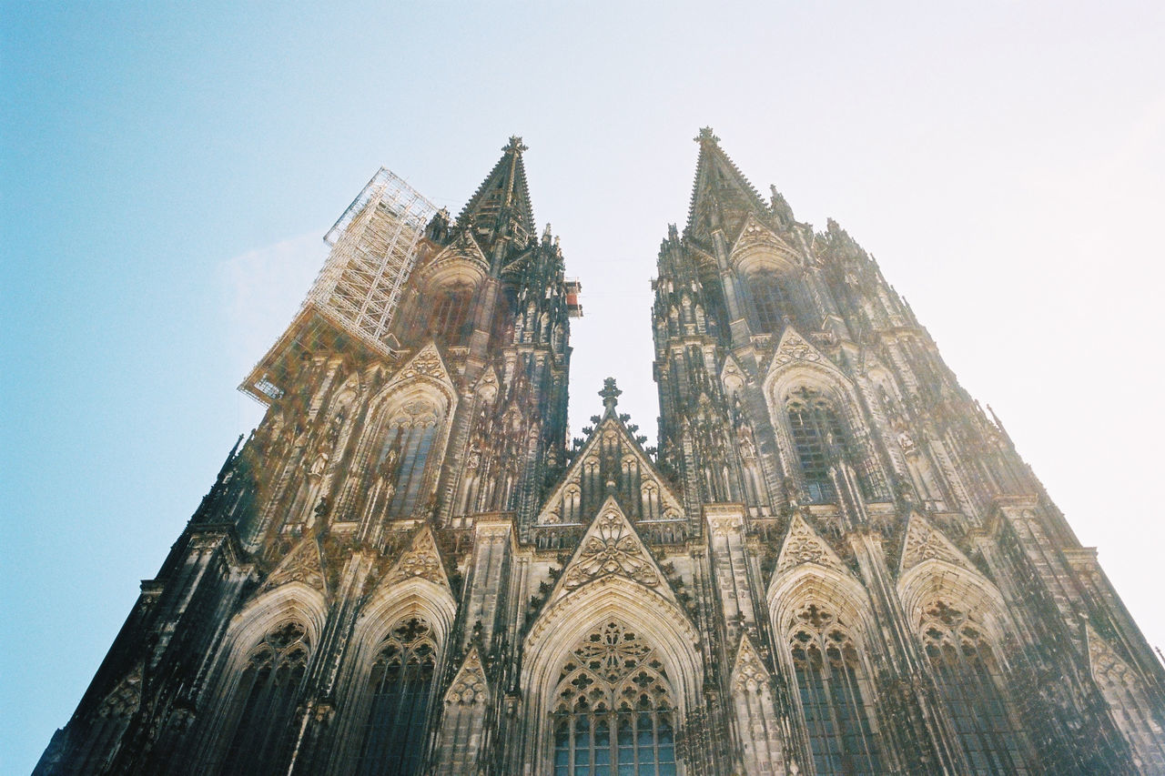 LOW ANGLE VIEW OF TEMPLE AGAINST BUILDING