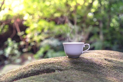 Close-up of coffee cup on table