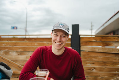 Portrait of young man standing in boat