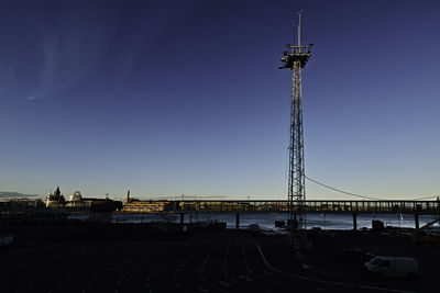 Tower against clear blue sky in city