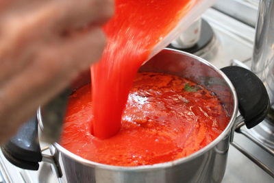 Close-up of red meat in cooking pan