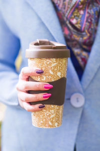 Close-up of woman holding ice cream