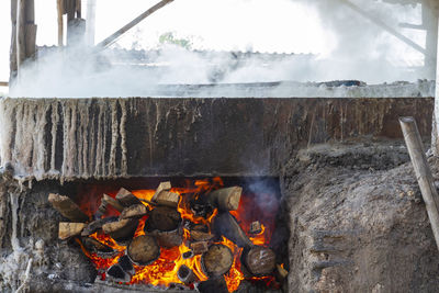 Firewood in a rock salt stove at ban dung, udon thani, thailand