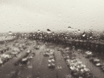 Full frame shot of wet glass window