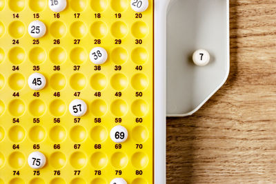 Close-up of yellow buttons on table