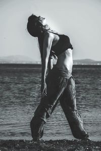 Woman exercising on beach