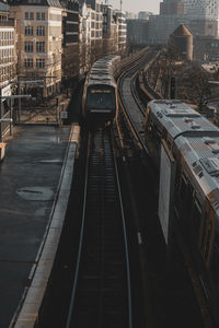 High angle view of train amidst buildings in city