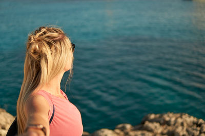 Rear view of woman looking at sea