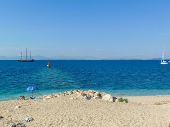 Scenic view of sea against blue sky